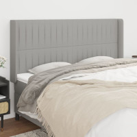 Produktbild för Sänggavel med kanter ljusgrå 163x16x118/128 cm tyg