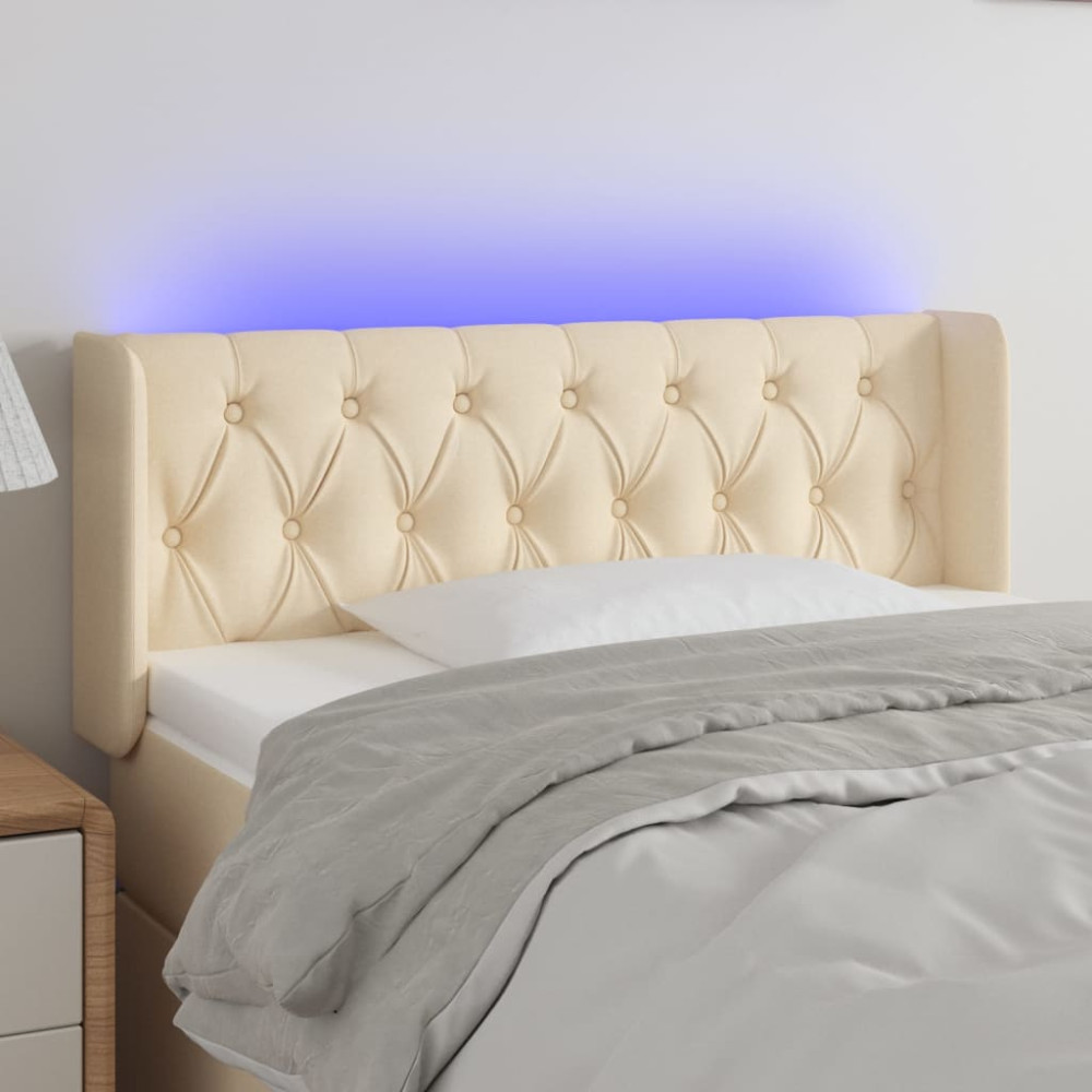 Produktbild för Sänggavel LED gräddvit 103x16x78/88 cm tyg
