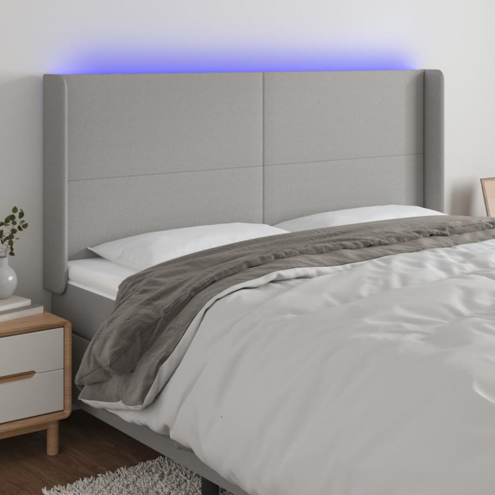 Produktbild för Sänggavel LED ljusgrå 163x16x118/128 cm tyg