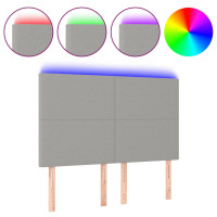 Produktbild för Sänggavel LED ljusgrå 144x5x118/128 cm tyg