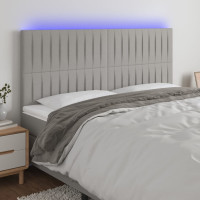 Produktbild för Sänggavel LED ljusgrå 160x5x118/128 cm tyg