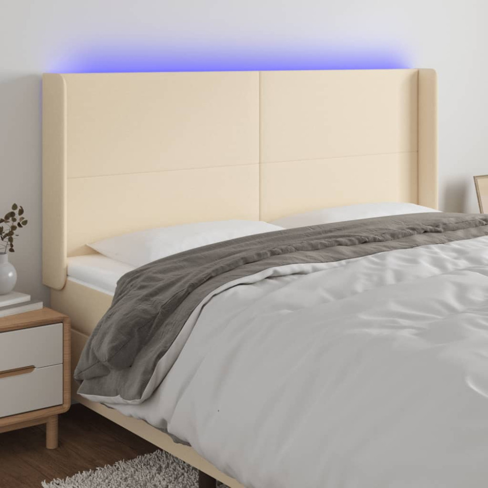 Produktbild för Sänggavel LED gräddvit 183x16x118/128 cm tyg