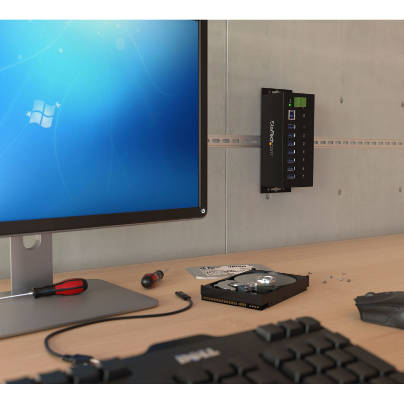 Produktbild för StarTech.com USB 3.0-hubb med 7 portar - 5Gbps - Industriell USB-A-hubb i metall med ESD-skydd och 350 W överspänningsskydd - Monterbar på DIN-skena, vägg eller skrivbord - TAA-kompatibel USB-expansionshubb